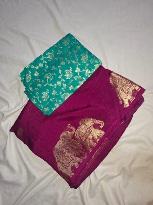 Elegant magenta saree with golden elephant motifs and a teal blouse